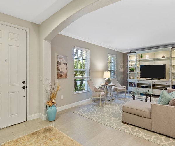 A cozy living room with neutral tones, modern furniture, and stylish decor.