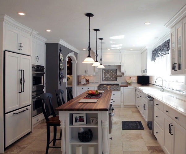 Charming kitchen with installed butcher block countertop showcasing elegant design